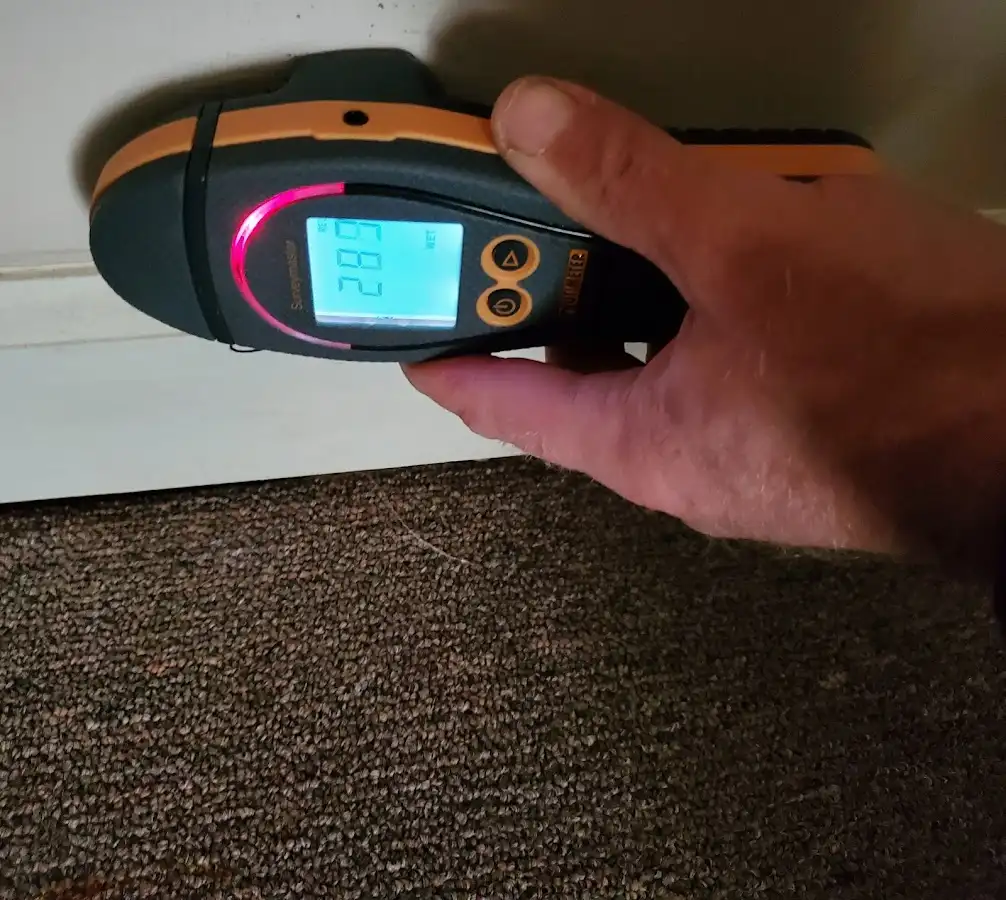 Moisture detection at baseboard during Storm Damage Restoration in North Highlands